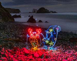 A glowing wizard created with light painting cooking by the ocean in this stop-motion short film by Dariustwin.
